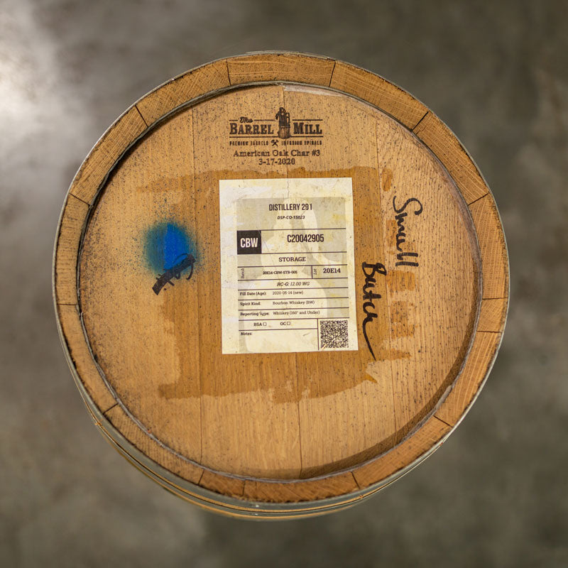Head of a 10 Gallon Distillery 291 Bourbon Whiskey Barrel with a sticker with bourbon information, small The Barrel Mill cooperage engraving and words Small Batch written in hand on the head
