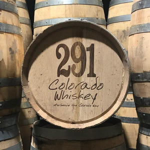 
                  
                    10 gallon Distillery 291 bourbon barrels stacked with one on its side with 291 Colorado Whiskey Homemade the Colorado Way engraved on head
                  
                