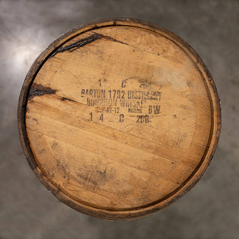 
                  
                    Head of a 1792 Bourbon Barrel with Barton 1792 Distillery information stamped on the head
                  
                