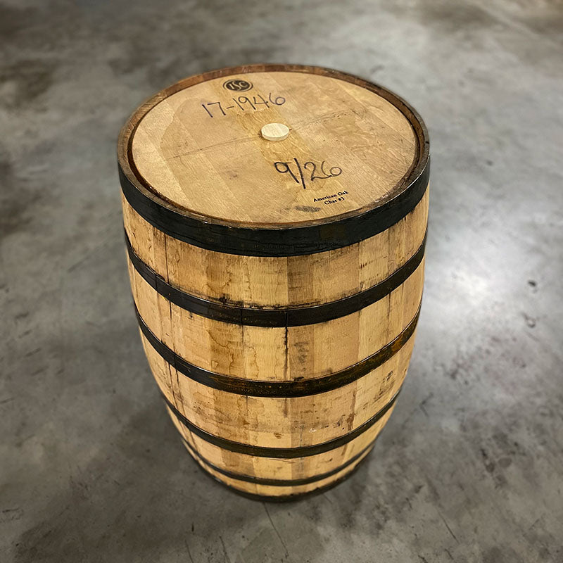 View of top head and side of a Stranahan's Whiskey Barrel with Head Bung