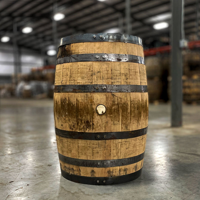 Side view of a Next Century Spirits Young Bourbon Barrel with rusted rings and stained wood