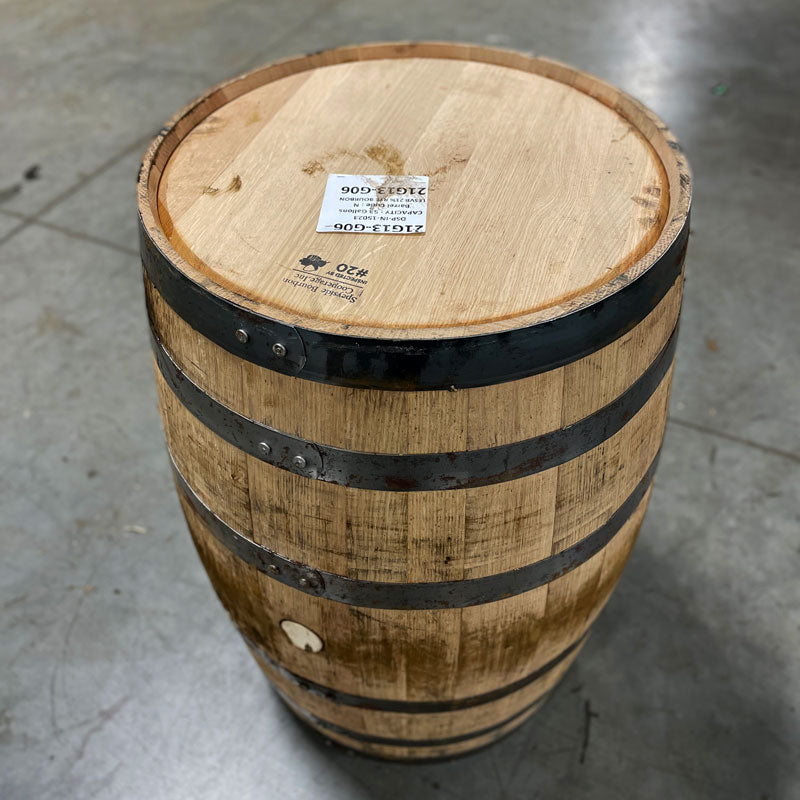 Next Century Spirits Young Bourbon Barrel with cooperage label and sticker on the head, lightly rusted rings and stained wood