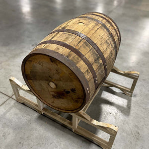 
                  
                    Templeton Rye Whiskey Barrel with head bung and belly bung on a rack
                  
                