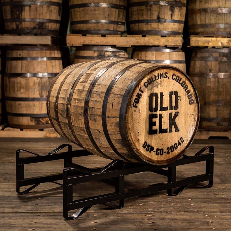 Old Elk Wheated Bourbon barrel on a rack with head stamped with Fort Collins, Colorado Old Elk DSP-CO-20042