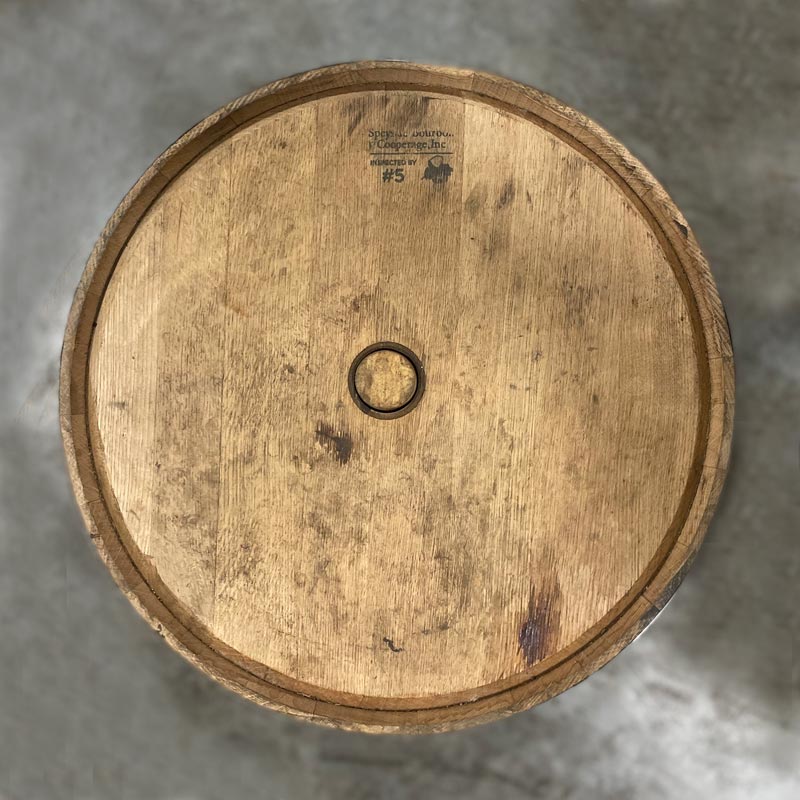 Head of a Penelope Bourbon Barrel with a head bung and cooperage engraving on the head