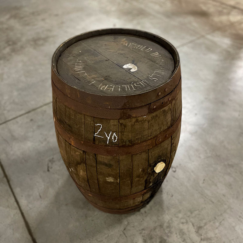 View of head and side of a Stranahan’s Whiskey Irish Cask Finish Barrel with stamps on head