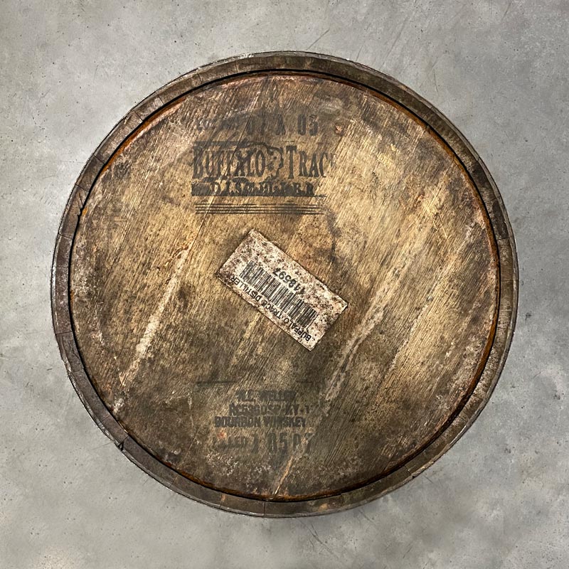 
                  
                    Head of a 15-Year Pappy Van Winkle Bourbon Barrel with Buffalo Trace Distillery logo and stamped information, including WL Weller label and dates
                  
                