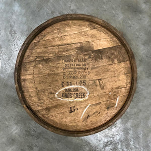 
                  
                    Head of a 10-Year Knob Creek Bourbon barrel with James B Beam distillery stamps and Knob Creek labeled on head
                  
                