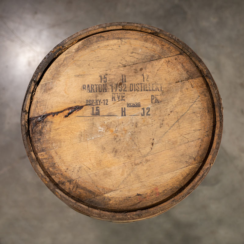 The head of a used 1792 High Rye Bourbon Barrel with Barton 1792 Distillery information stamped on the head