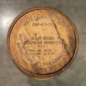 
                  
                    Head of a used 8 year Willett Bourbon barrel with distillery information and age statement stamped on the head
                  
                