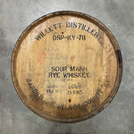 Head of a Willett Family Estate Rye Whiskey barrel with distillery markings stamped on head