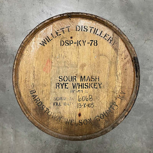 
                  
                    Head of a Willett Family Estate Rye Whiskey barrel with distillery markings stamped on head
                  
                