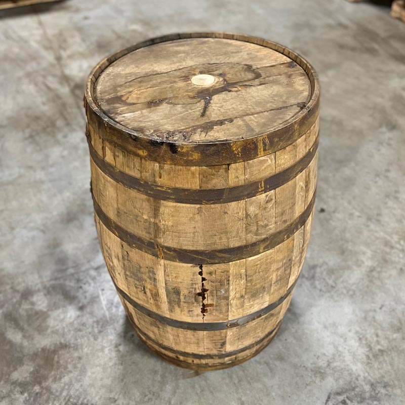 Head and side of an Old Elk Rye Whiskey barrel with a head bung