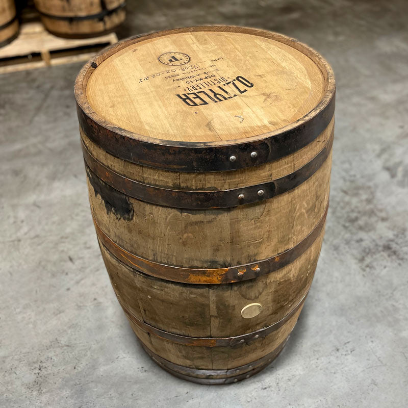 Head and side of an OZ Tyler Distillery Bourbon Whiskey Barrel with distillery name, number and fill date on the head