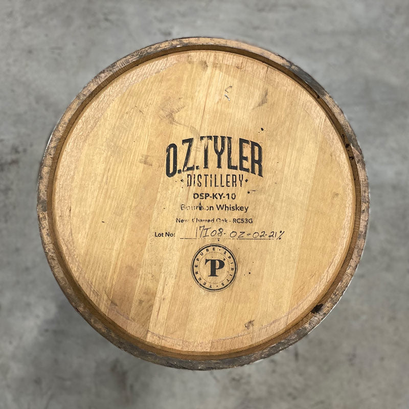 Head of an OZ Tyler Distillery Bourbon Whiskey Barrel with distillery name, number and fill date on the head