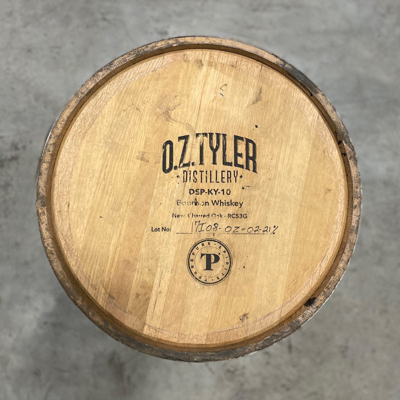 
                  
                    Head of an OZ Tyler Distillery Bourbon Whiskey Barrel with distillery name, number and fill date on the head
                  
                