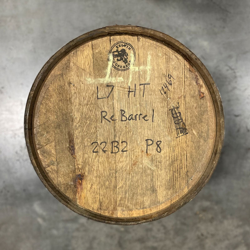 Head of a Lucky Seven Bourbon Holiday Toast Barrel with Kelvin Cooperage stamp and L7 HT ReBarrel and fill date handwritten on head.