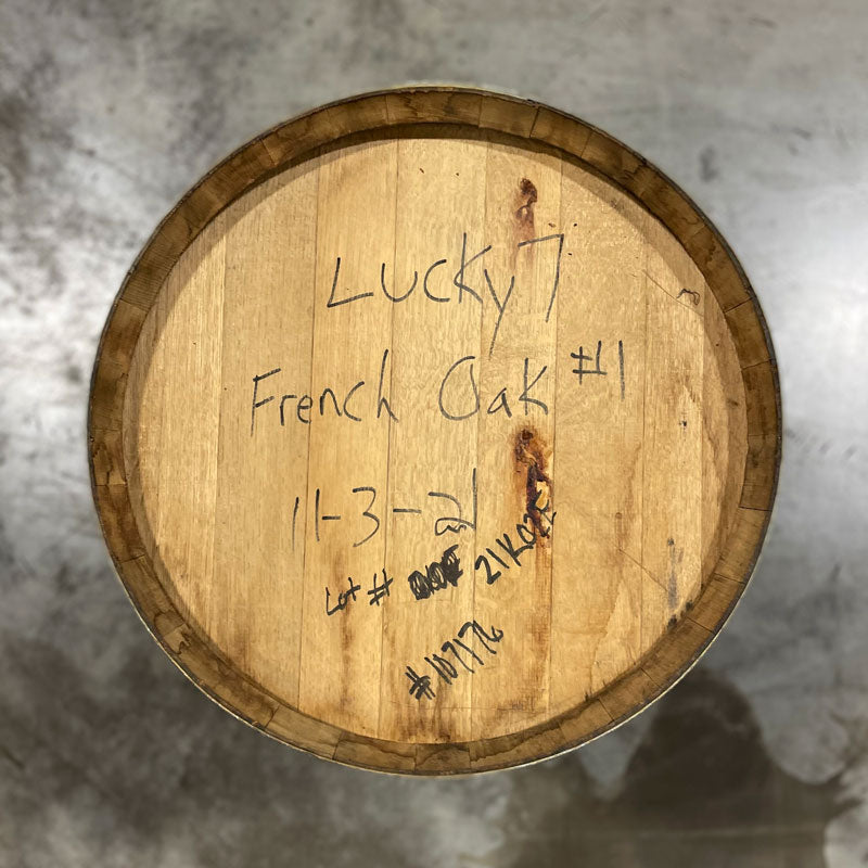 Head of a Lucky Seven Bourbon The Frenchman Cask Finish Barrel with Lucky 7 French Oak 1 and fill date handwritten on the head