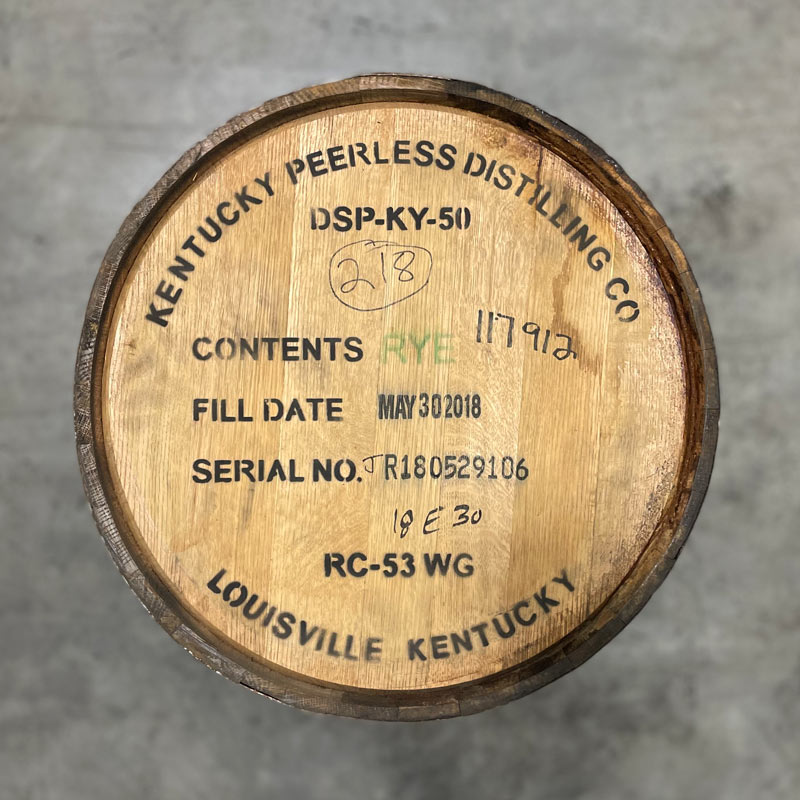 Head of a Peerless Rye Whiskey Barrel with distillery name, information and fill date stamped on the head.