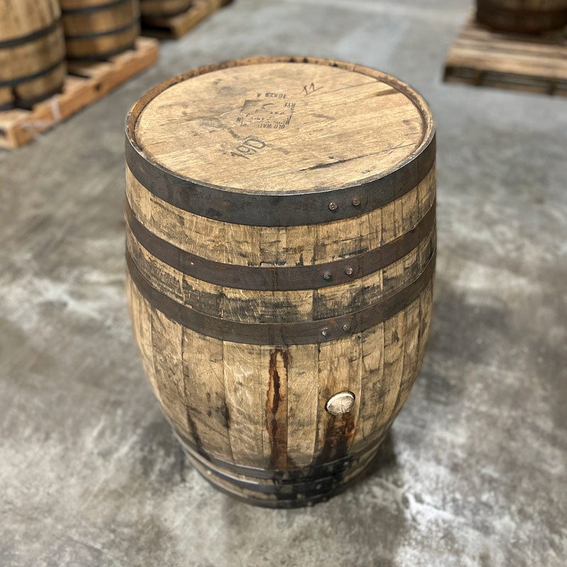 Head and side of a Woodford Reserve Rye Whiskey Barrel with Old Watermill markings stamped on the head