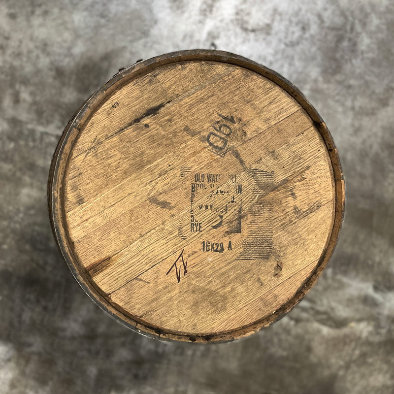 Head of a Woodford Reserve Rye Whiskey Barrel with Old Watermill Brown-Forman markings stamped on the head