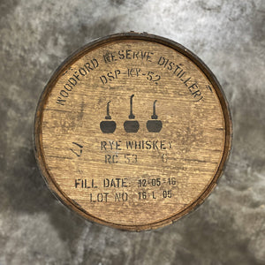 
                  
                    Head of a Woodford Reserve Rye Whiskey Barrel with Woodford Reserve Distillery DSP-KY-52 and 3 stills and other information stamped on the head
                  
                