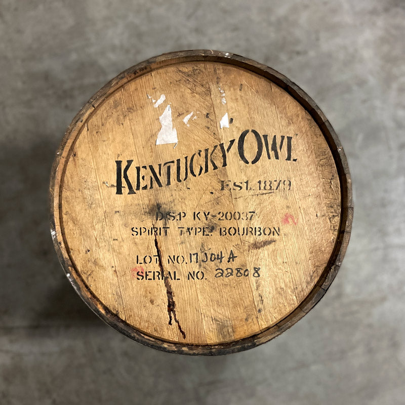 Head of a Kentucky Owl Bourbon Barrel with Kentucky Owl Est. 1879 and distillery information stamped on the barrel