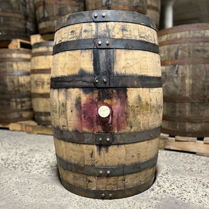 
                  
                    Bunghole side of an Arrington Vineyards Red Wine Bourbon Barrel with other used barrels in the background
                  
                
