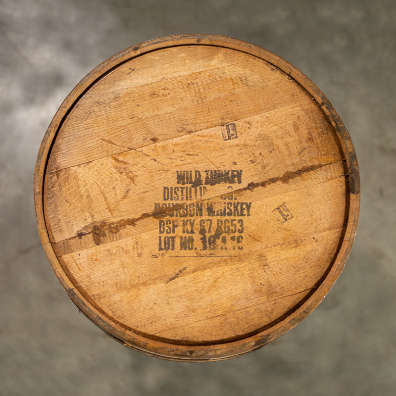 
                  
                    Head of a used 4 year Wild Turkey Bourbon barrel with distillery information stamped on the head
                  
                