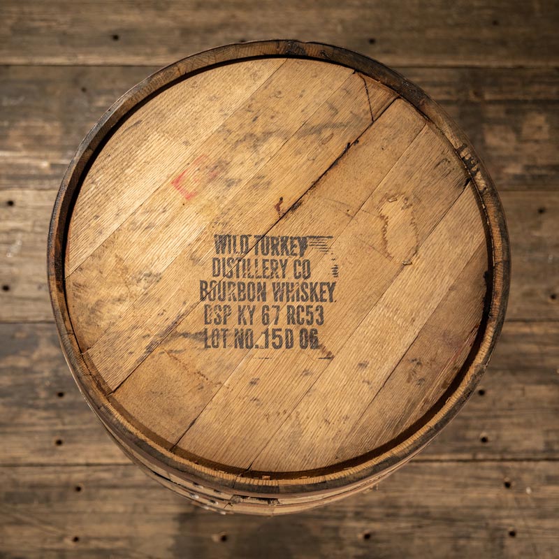 View of top of 4 year Wild Turkey bourbon whiskey barrel with distillery markings and information on the head