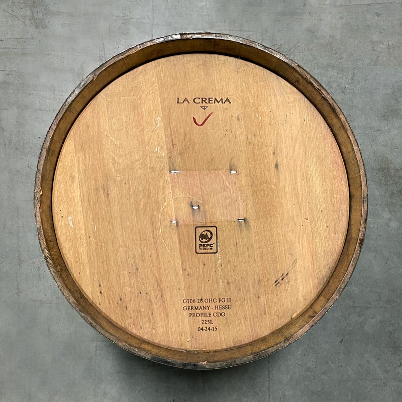
                  
                    Head of a tawny port barrel with La Crema winery markings
                  
                