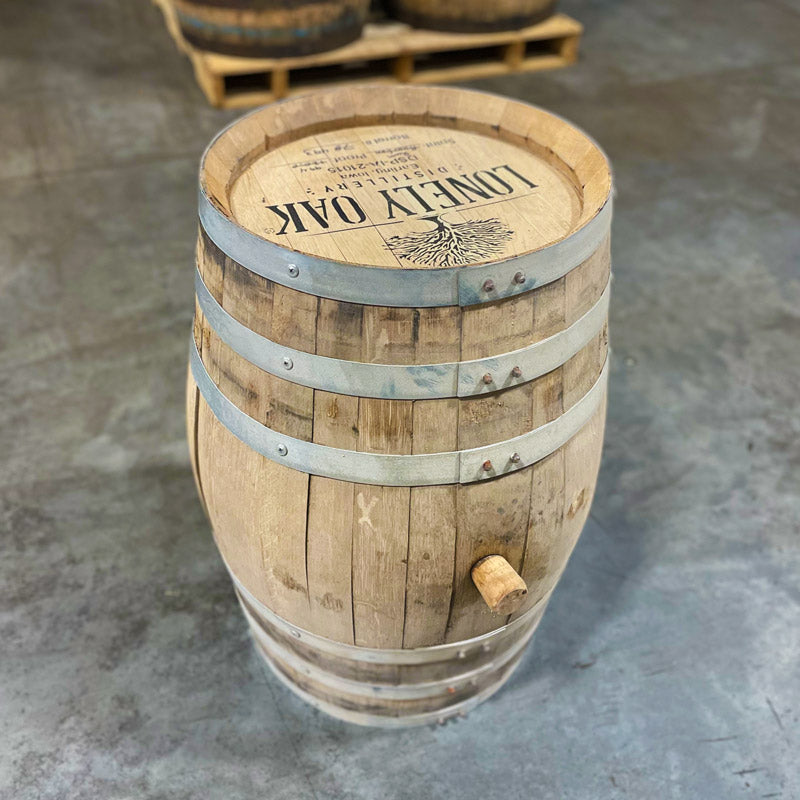 Side and head of a 15 Gallon Lonely Oak Rum Barrel Ex-Bourbon with tree and Lonely Oak Distillery logo and distillery information stamped on the head