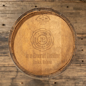 
                  
                    View from above of head of 13 Gallon John Emerald Distilling Whiskey barrel with stamp logo with text JE A True Souther Spirit John Emerald Distilling Opelika, Alabama
                  
                