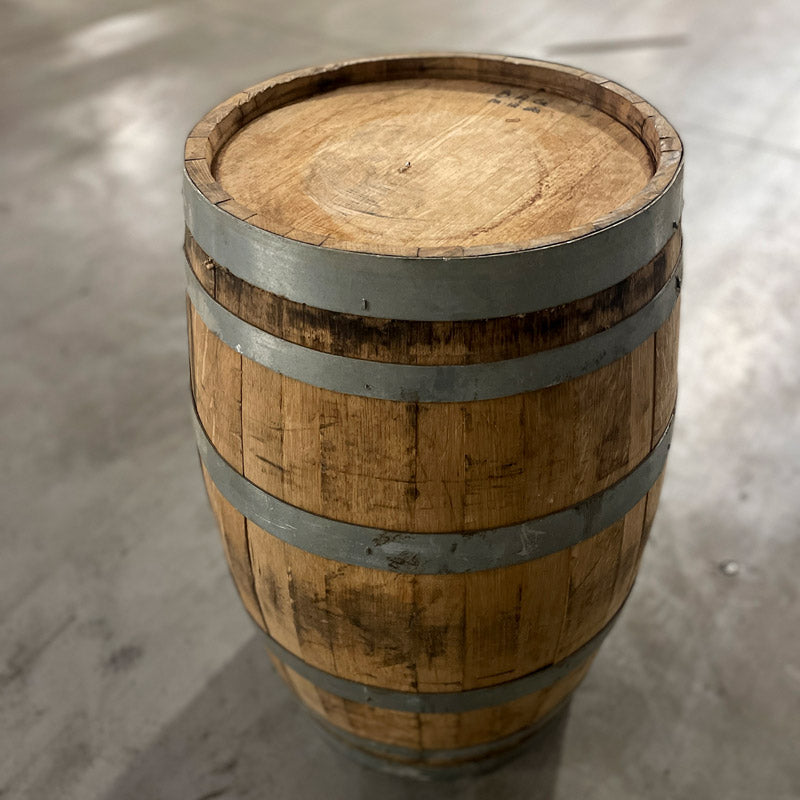 Closeup view of head and side of 13 gallon John Emerald Distilling gin barrel