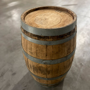 
                  
                    Closeup view of head and side of 13 gallon John Emerald Distilling gin barrel
                  
                