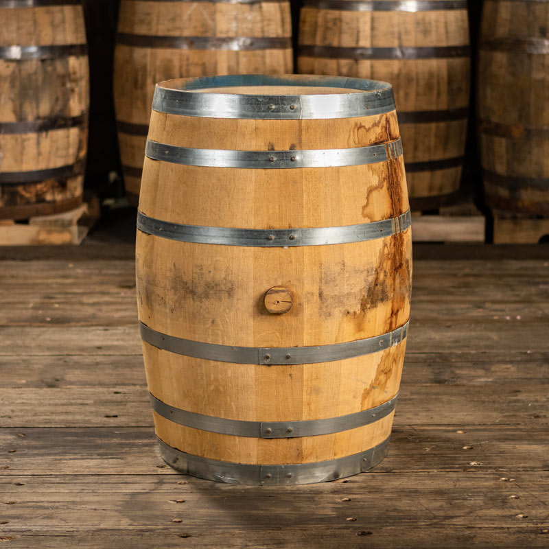 
                  
                    30 gallon FEW Spirits Rye Whiskey barrel with shiny steel bands and slightly stained staves
                  
                