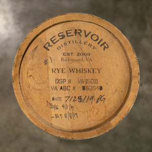 
                  
                    Head of a used 10 Gallon Reservoir Distillery Rye Whiskey barrel with distillery name and information stamped on the head
                  
                