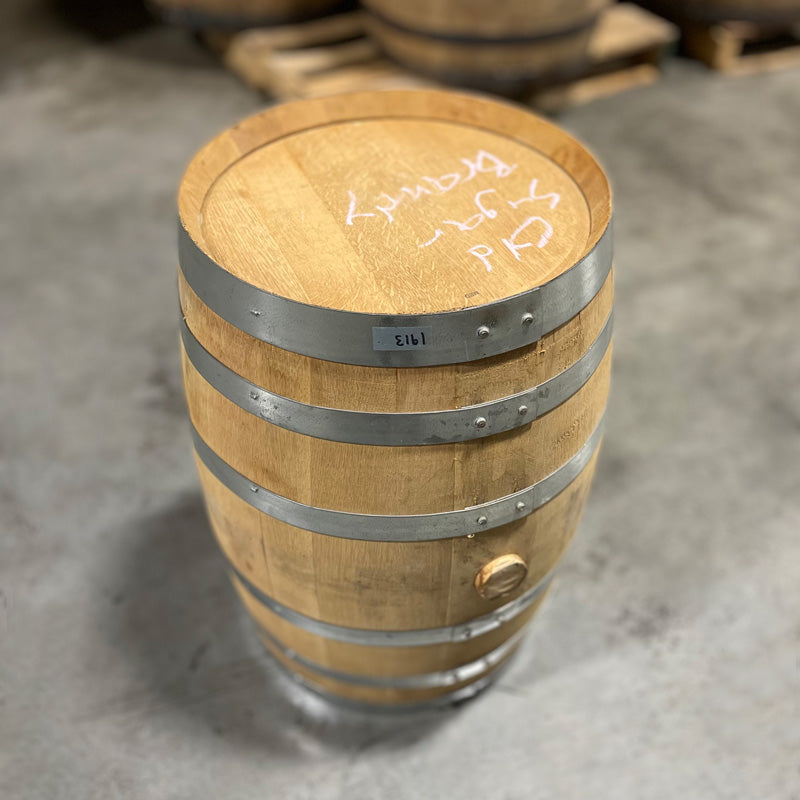 Head and side of a 15 Gallon Old Sugar Distillery Brandy Barrel with Old Sugar Brandy handwritten in chalk on the head