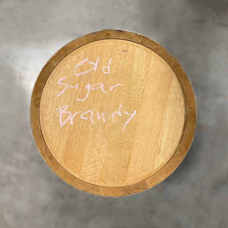 Head of a 15 Gallon Old Sugar Distillery Brandy Barrel with Old Sugar Brandy handwritten in chalk on the head