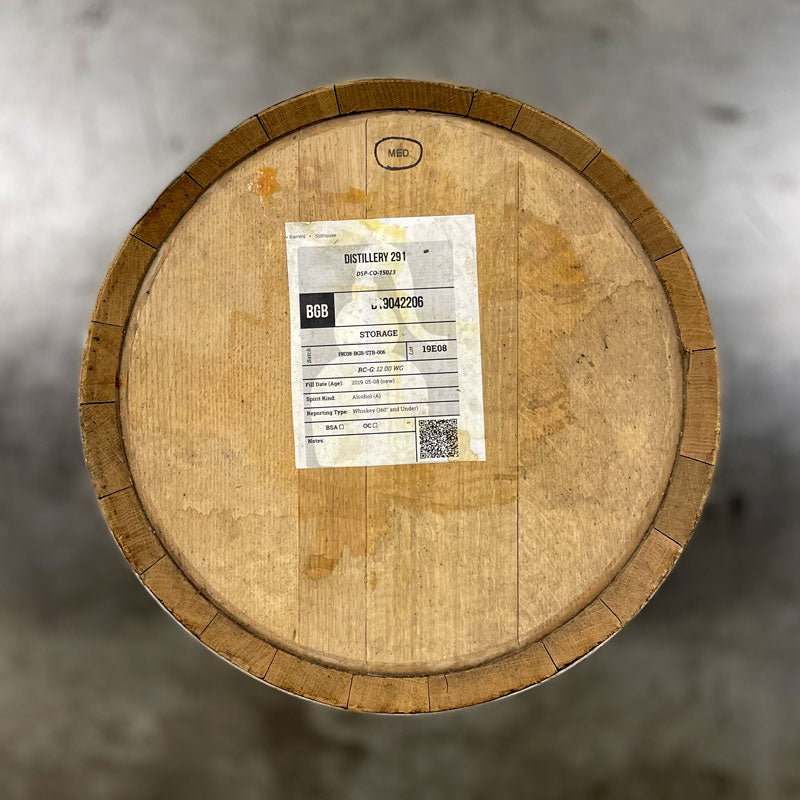 Head of a 10 Gallon Distillery 291 Bad Guy Bourbon barrel with information sticker on the head