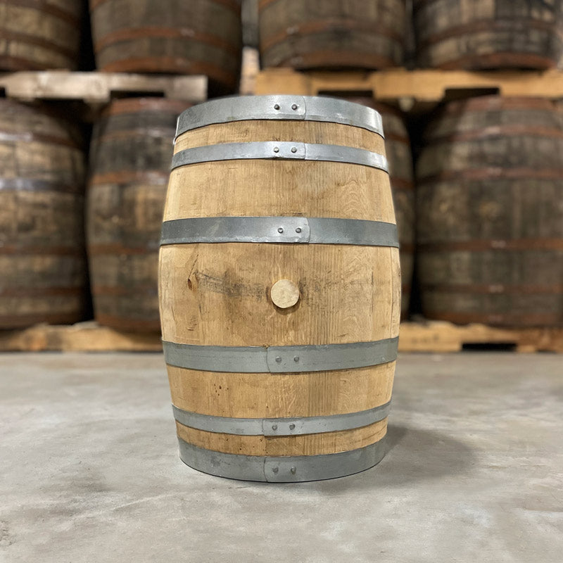 
                  
                    Side and bung of a 15 Gallon Rock Town Distillery Single Malt Whiskey Barrel with other used barrels on pallets in the background
                  
                