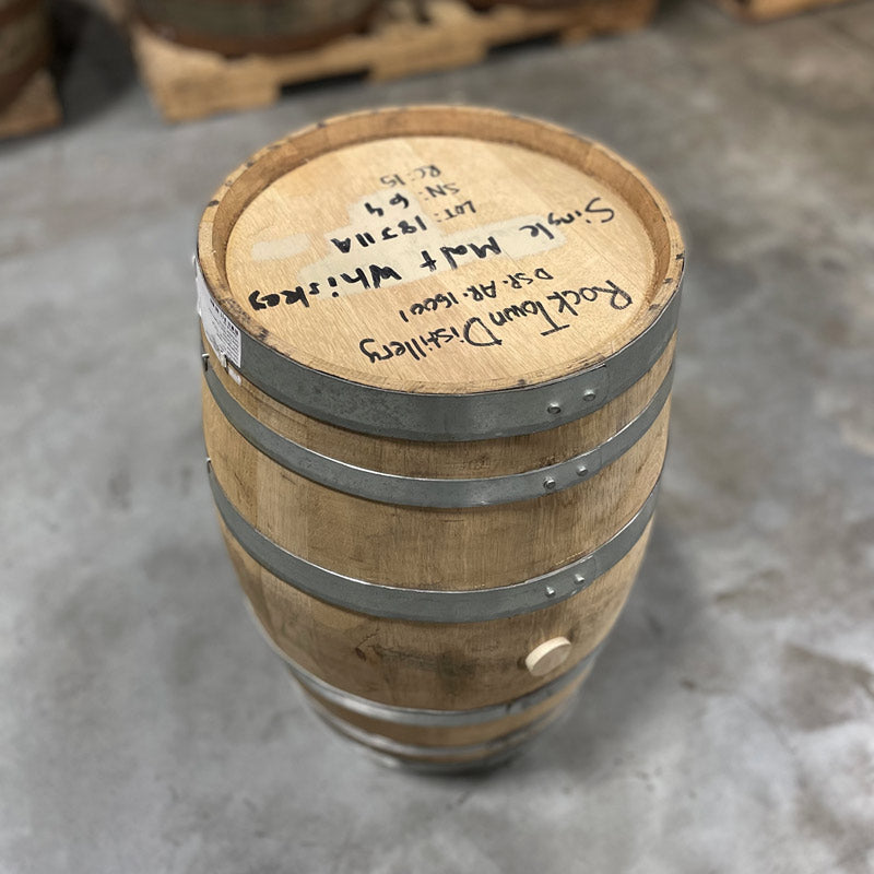 Head and side with bung of a 15 Gallon Rock Town Distillery Single Malt Whiskey Barrel with handwritten distillery information and barrel notes on the head