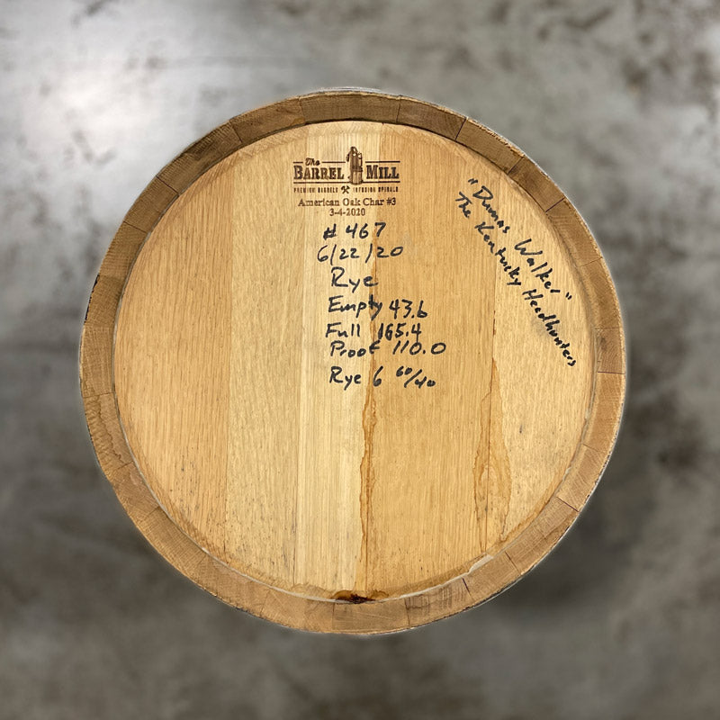 Head of a 15 Gallon Lonely Oak Rye Whiskey Barrel with handwritten notes on the head, including fill date and spirit info.