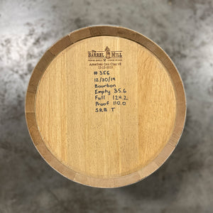 
                  
                    Head of a 10 Gallon Lonely Oak Bourbon Barrel with handwritten fill date, spirit information and other notes on the head. 
                  
                