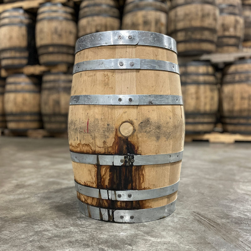 
                  
                    Side with bung of a 15 Gallon West Fork Chocolate Rye Bourbon Barrel and used bourbon barrels in the background
                  
                