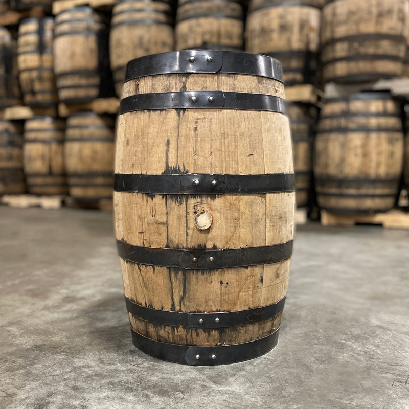 
                  
                    Side with bung of a 25 Gallon Rock Town Rye Whiskey Barrel with used barrels in the background
                  
                