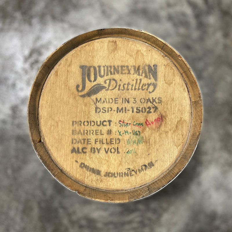 Head of a 5 Gallon Journeyman Honey Barrel that first aged Silver Cross Whiskey with Journeyman logo on the head