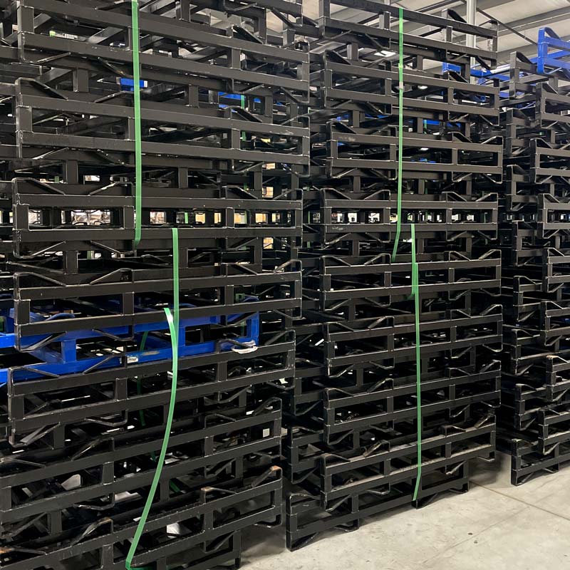 Stacks of used, black and blue 2-barrel steel rack with 3-inch clearance height