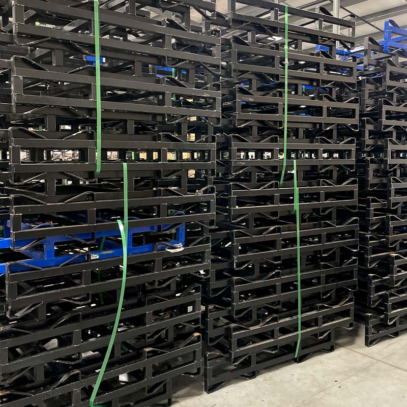 
                  
                    Stacks of used, black and blue 2-barrel steel rack with 3-inch clearance height
                  
                