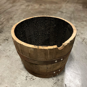 
                  
                    A 15 gallon whiskey barrel cut in half with a charred interior to be used as a planter
                  
                